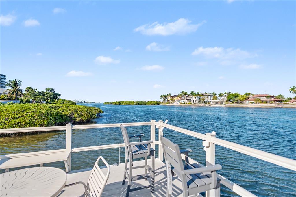 6157 Midnight Pass Road, Unit E23 Sarasota, FL 34242 - Photo 42 of 49 a view of a terrace with outdoor seating