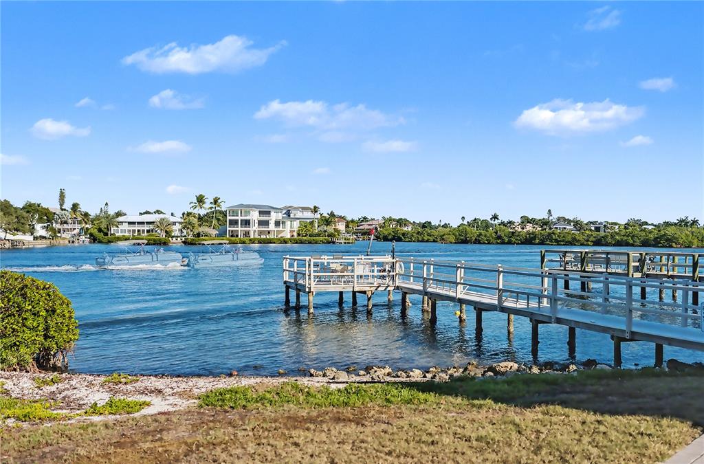 6157 Midnight Pass Road, Unit E23 Sarasota, FL 34242 - Photo 47 of 49 a view of a city from a lake