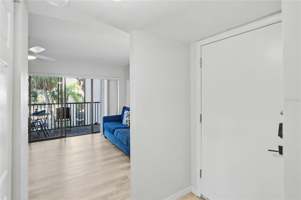 6157 Midnight Pass Road, Unit E23 Sarasota, FL 34242 - Photo 7 of 49 a view of hallway with furniture