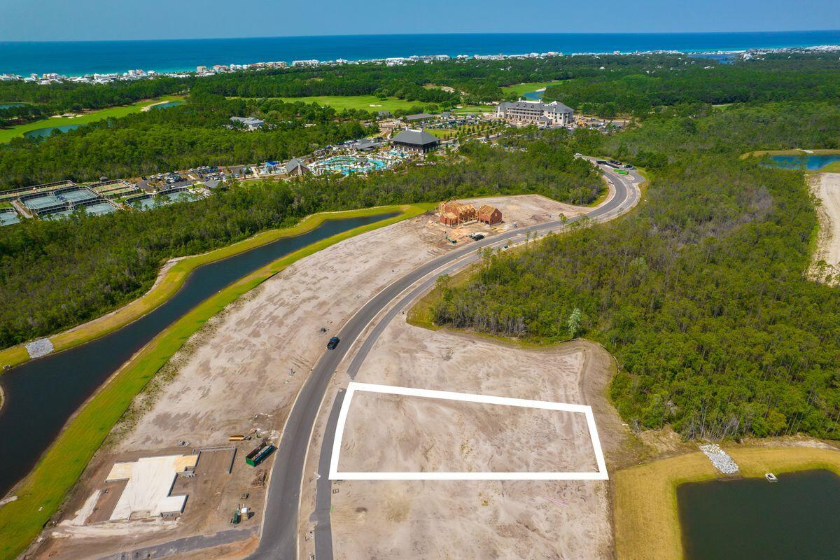 Lot 29 Windsong Inlet Beach Inlet Beach, FL 32461 - Photo 3 of 12 an aerial view of a house with a yard and lake view