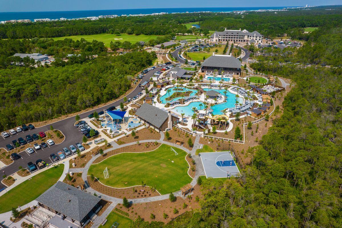 Lot 29 Windsong Inlet Beach Inlet Beach, FL 32461 - Photo 4 of 12 an aerial view of a house with a garden and lake view