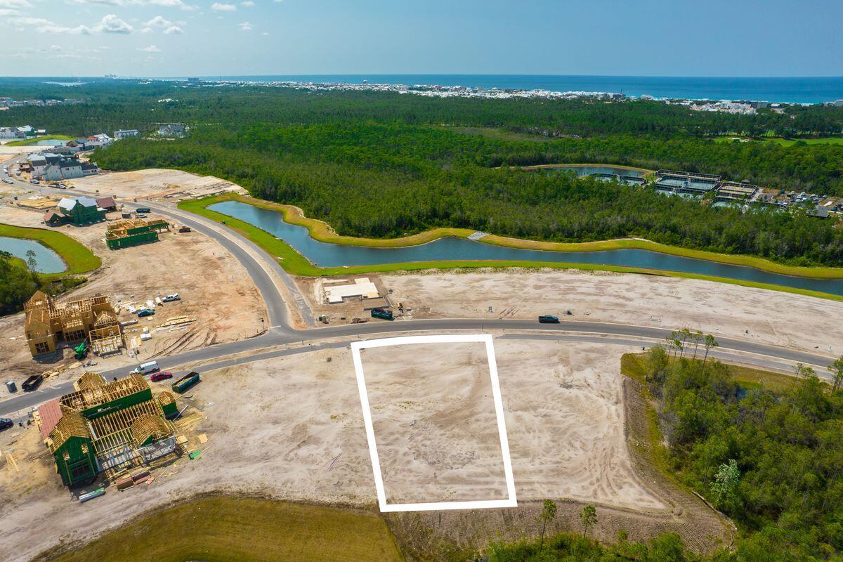 Lot 29 Windsong Inlet Beach Inlet Beach, FL 32461 - Photo 7 of 12 an aerial view of a house with a garden and lake view