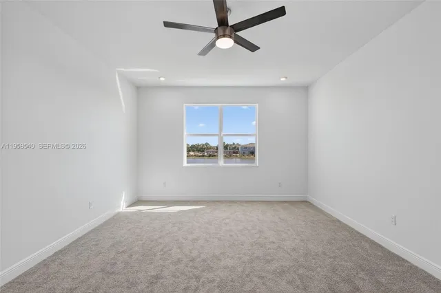 a view of a ceiling fan and wooden floor