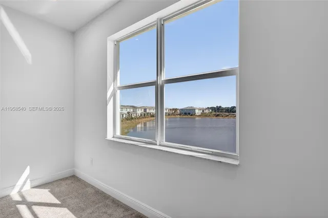 a white toilet sitting next to a white sink