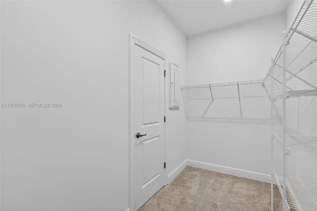 a view of a house with backyard and porch