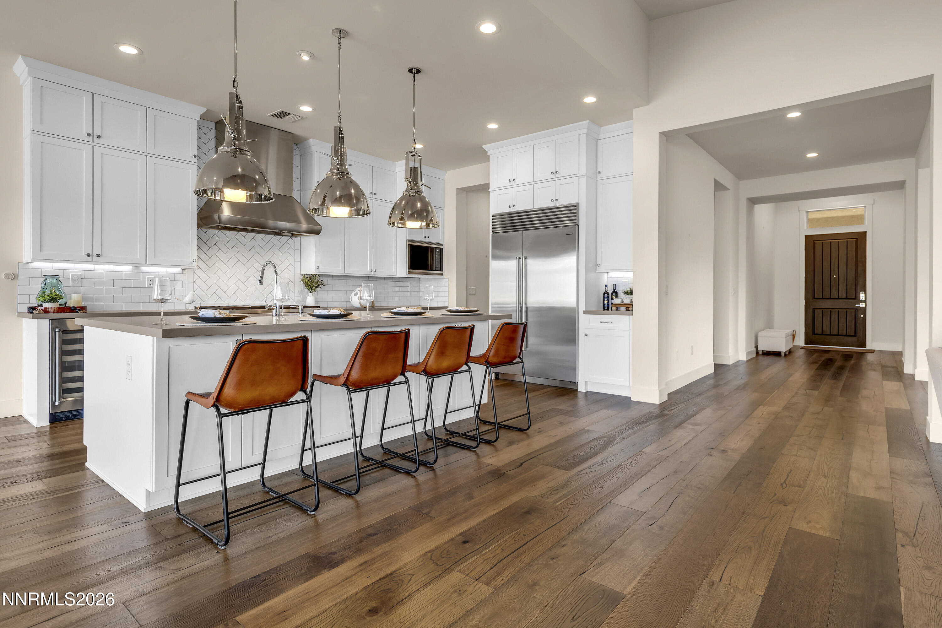 9219 Wild Skies Court Reno, NV 89523 - Photo 13 of 38 a large kitchen with a table and chairs