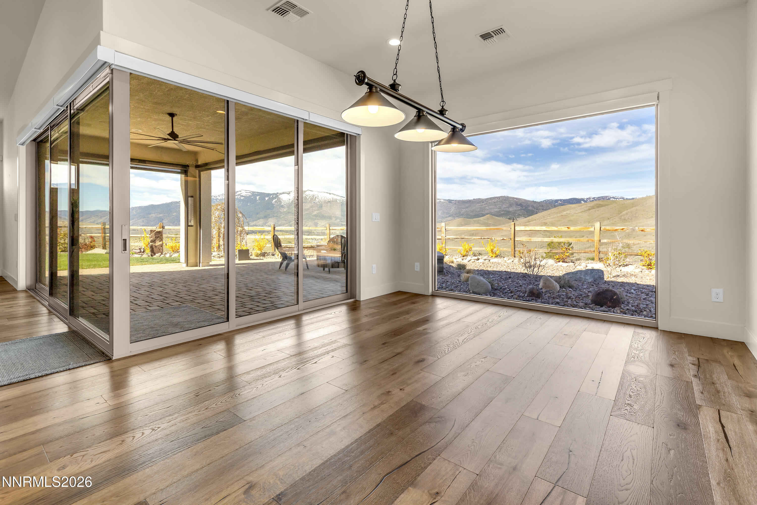 9219 Wild Skies Court Reno, NV 89523 - Photo 22 of 38 a view of a floor to ceiling window with wooden floor