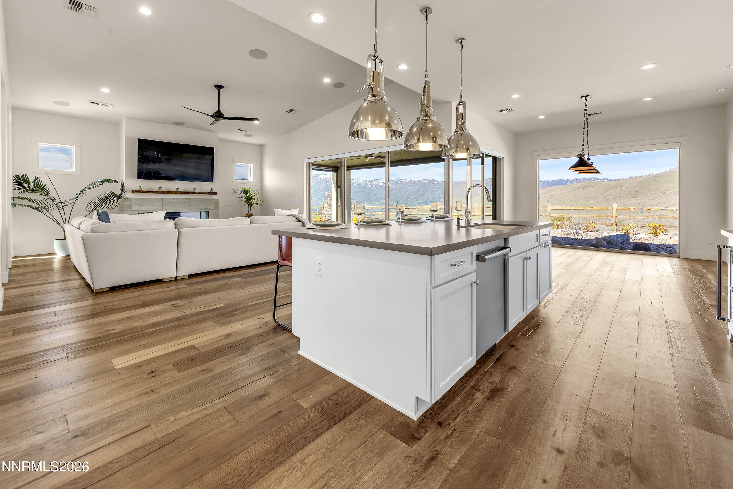 9219 Wild Skies Court Reno, NV 89523 - Photo 24 of 38 a large kitchen with stainless steel appliances kitchen island a large island in the center