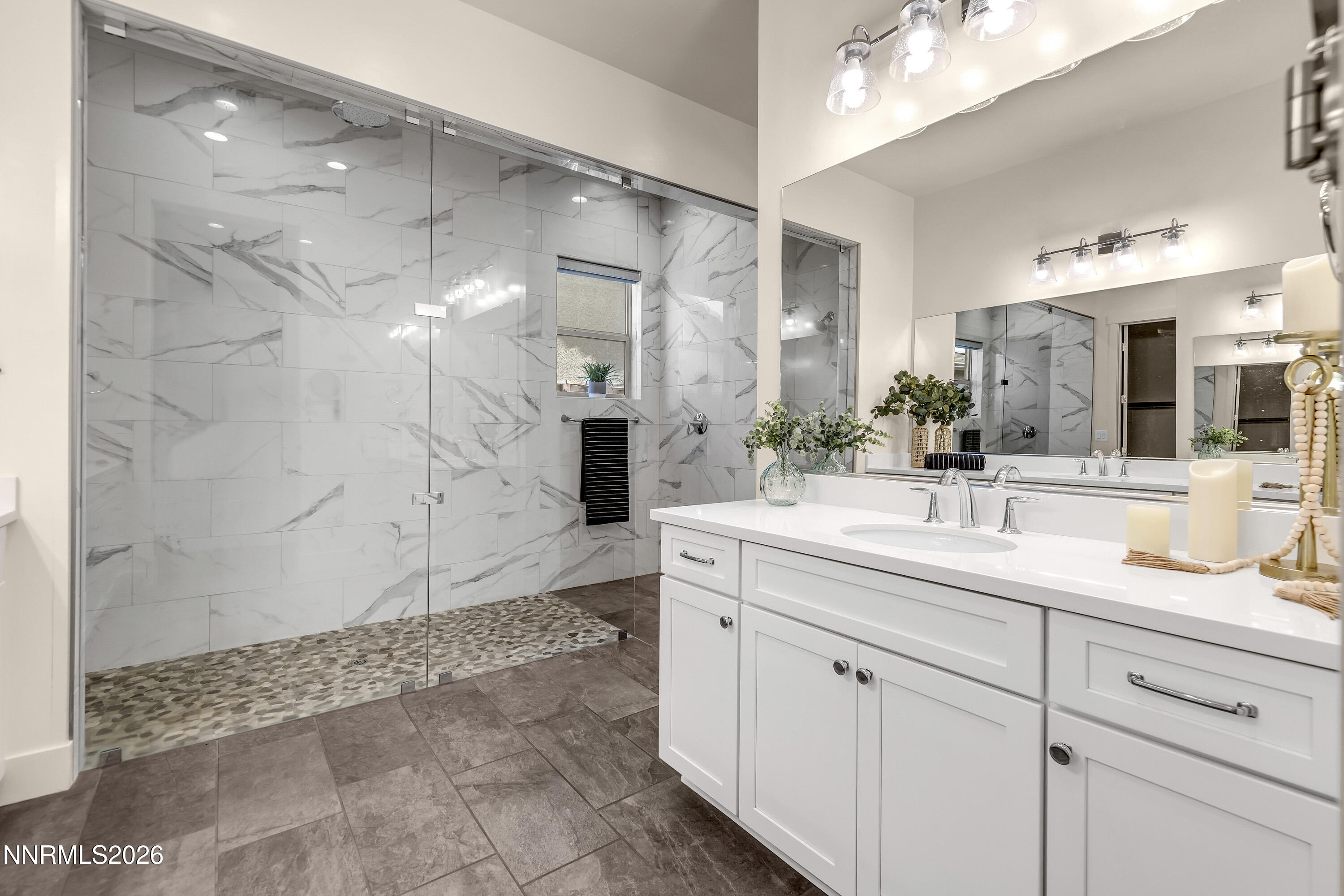9219 Wild Skies Court Reno, NV 89523 - Photo 25 of 38 a bathroom with a sink and a mirror