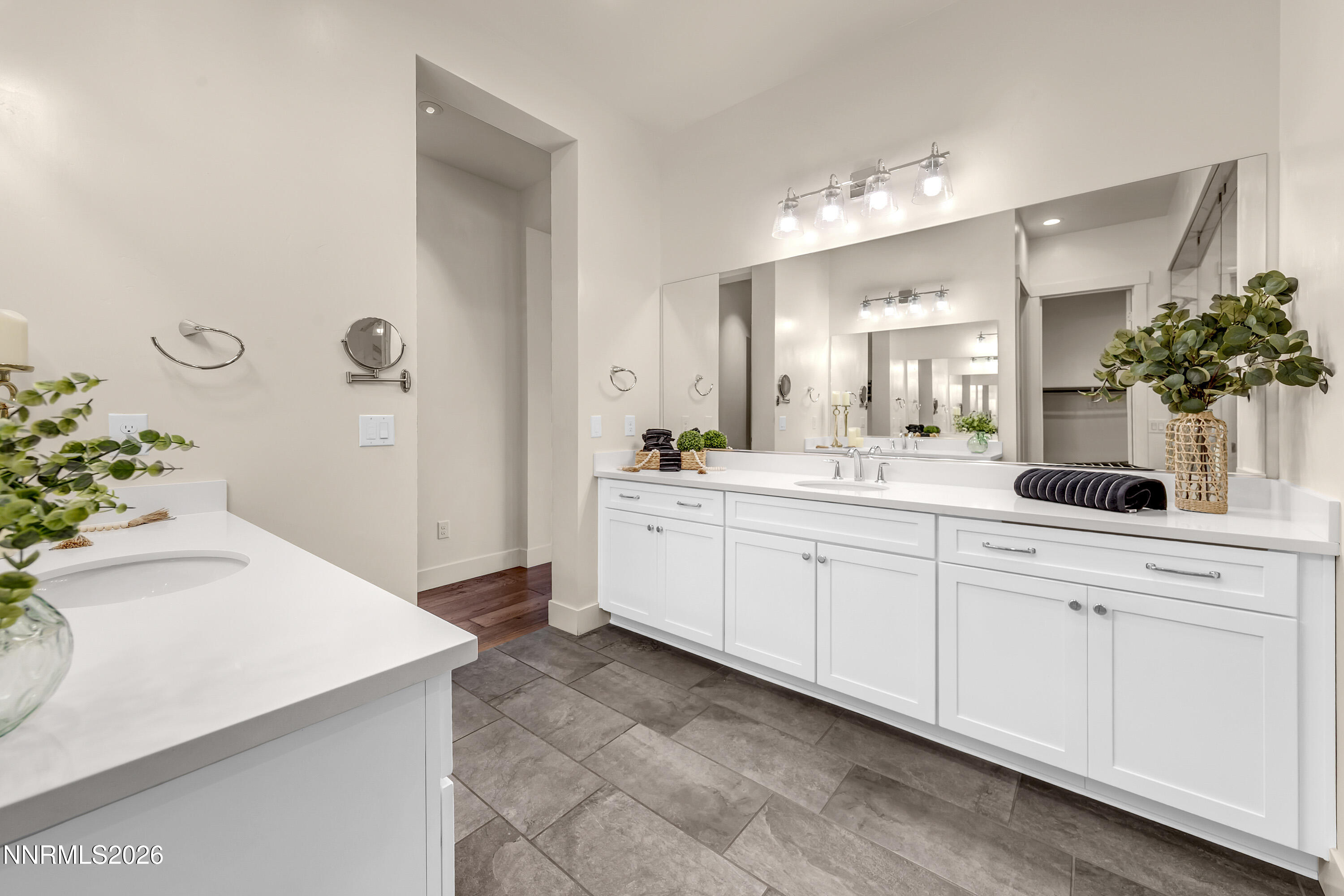 9219 Wild Skies Court Reno, NV 89523 - Photo 27 of 38 a spacious bathroom with a sink double vanity and mirror