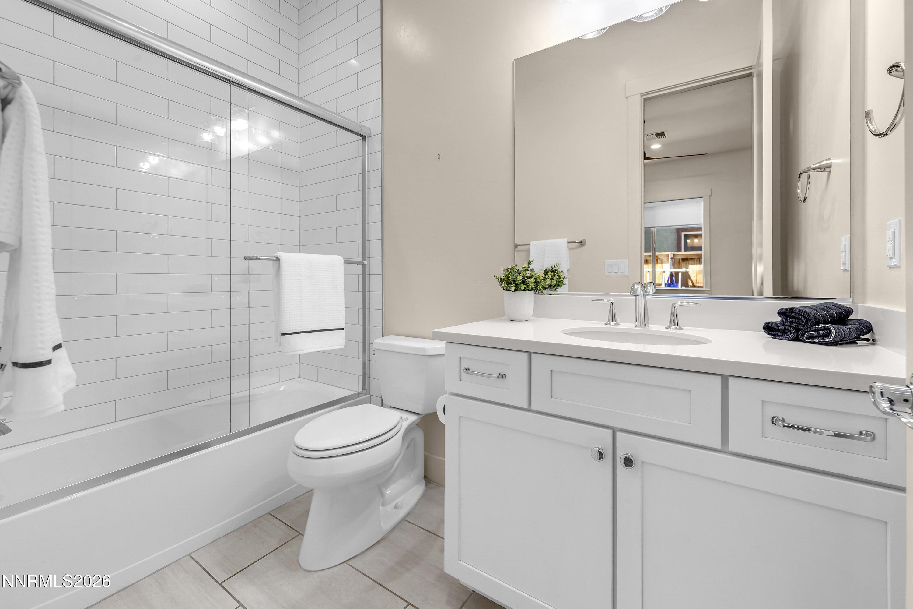 9219 Wild Skies Court Reno, NV 89523 - Photo 30 of 38 a bathroom with a sink a toilet and shower