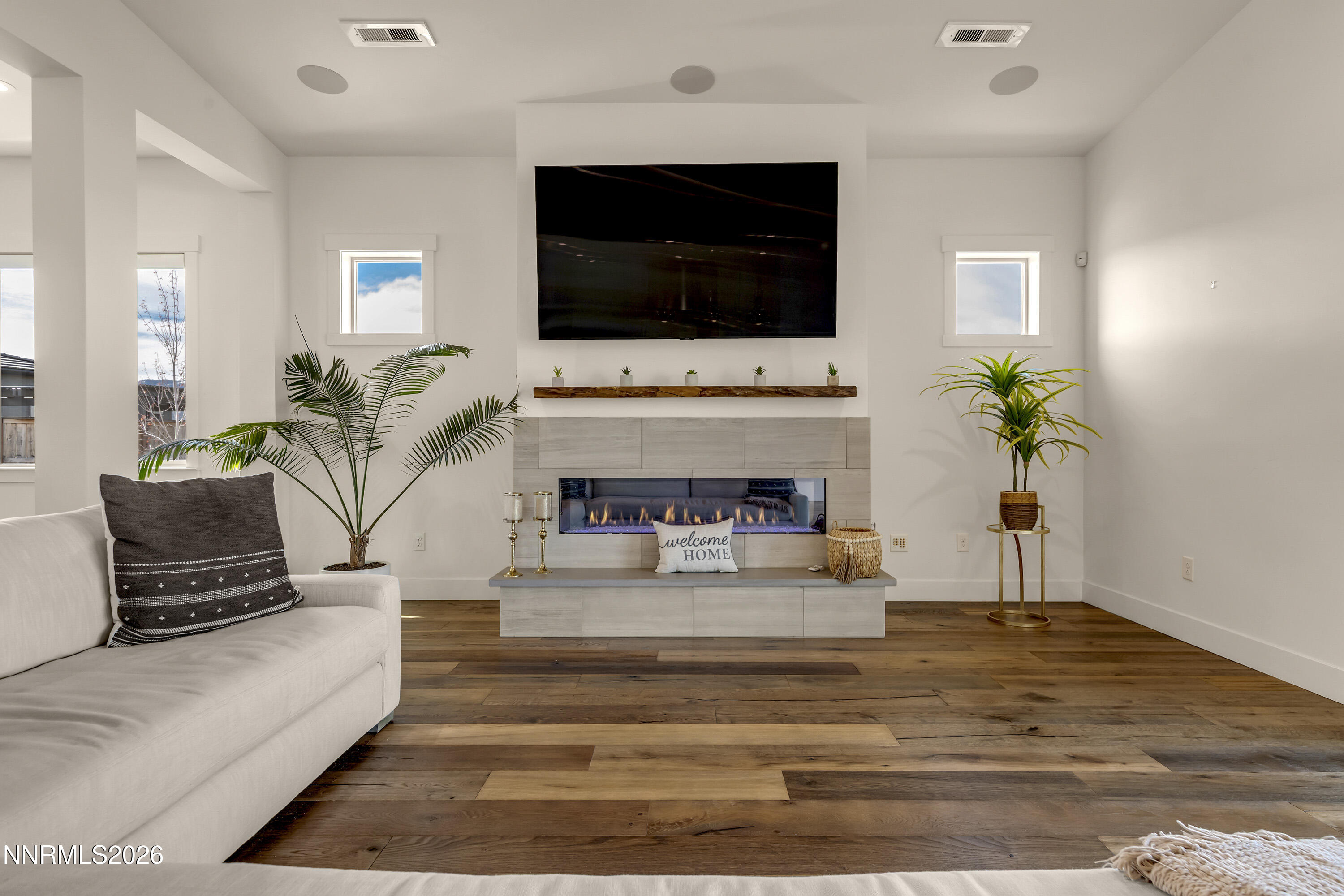 9219 Wild Skies Court Reno, NV 89523 - Photo 3 of 38 a living room with furniture and a flat screen tv