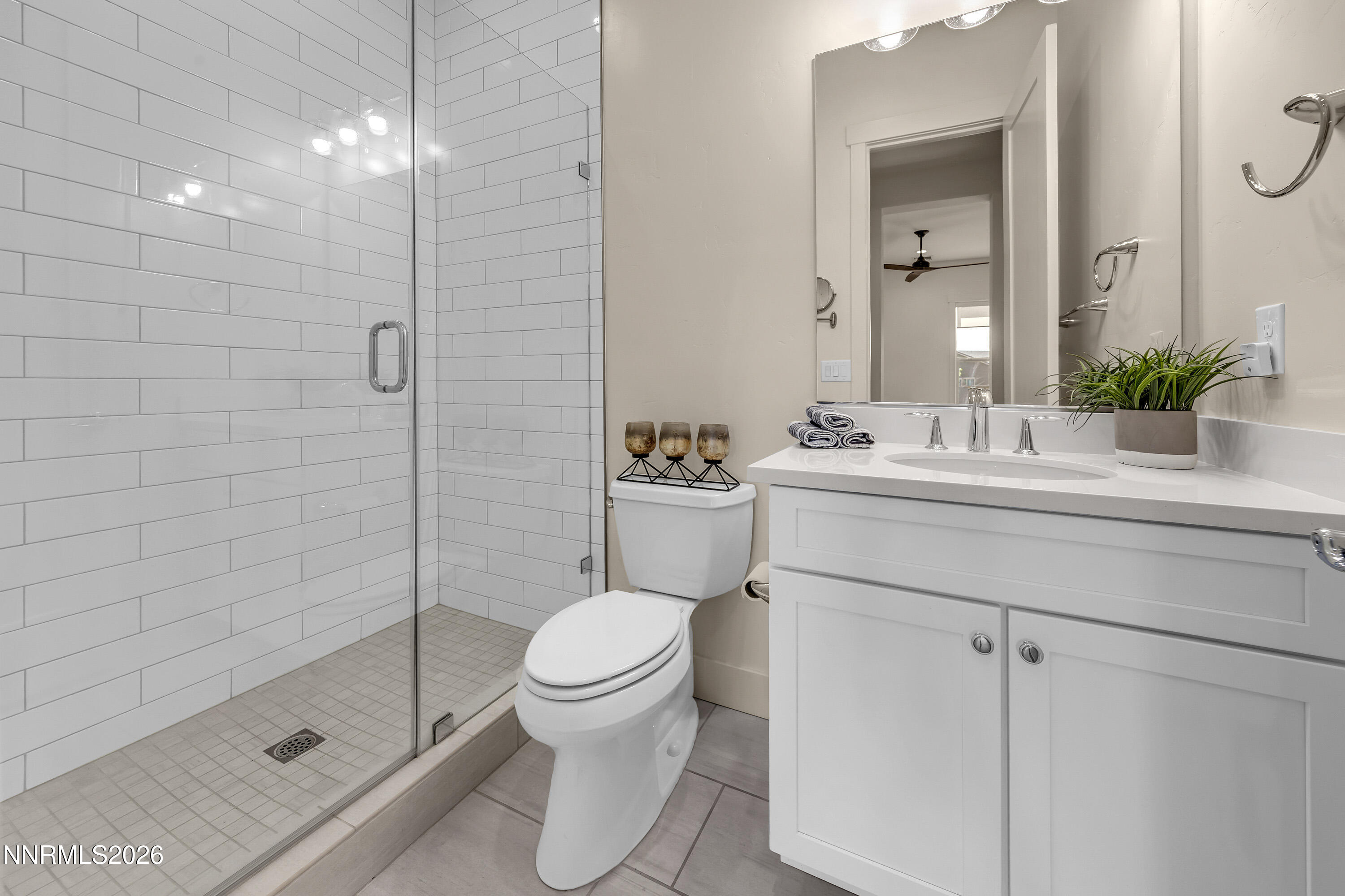 9219 Wild Skies Court Reno, NV 89523 - Photo 31 of 38 a bathroom with a sink toilet and shower