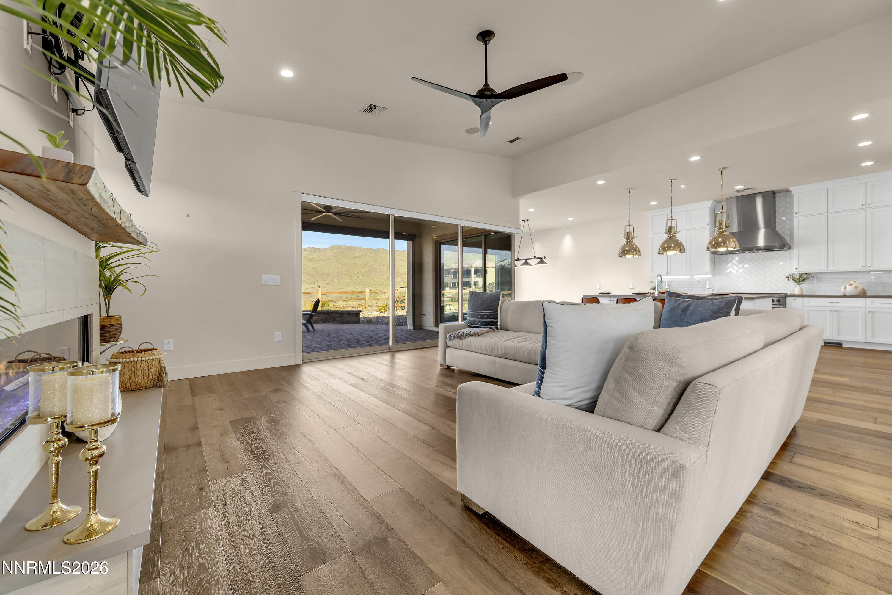9219 Wild Skies Court Reno, NV 89523 - Photo 5 of 38 a living room with furniture and a wooden floor