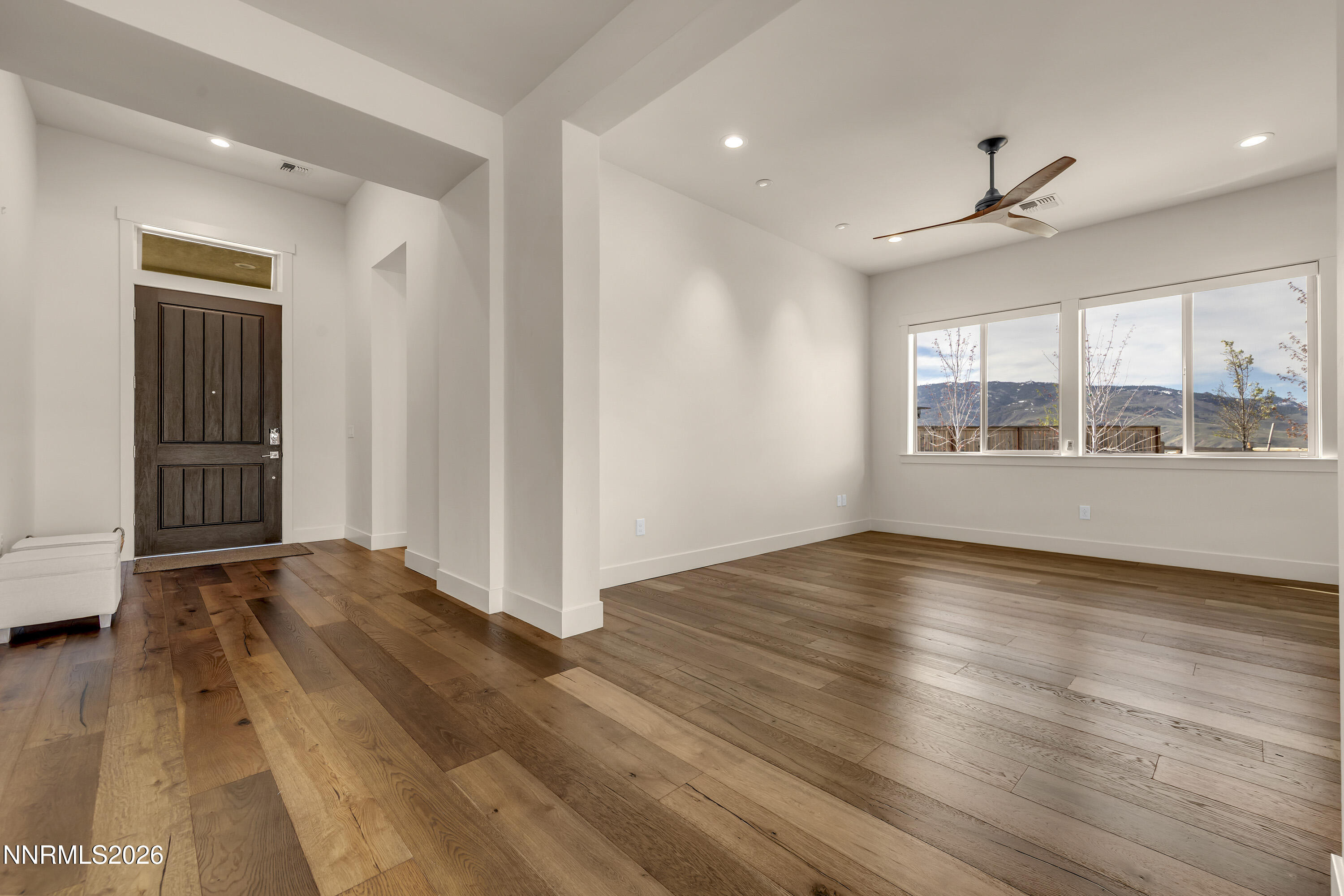 9219 Wild Skies Court Reno, NV 89523 - Photo 6 of 38 a view of empty room with wooden floor and fan