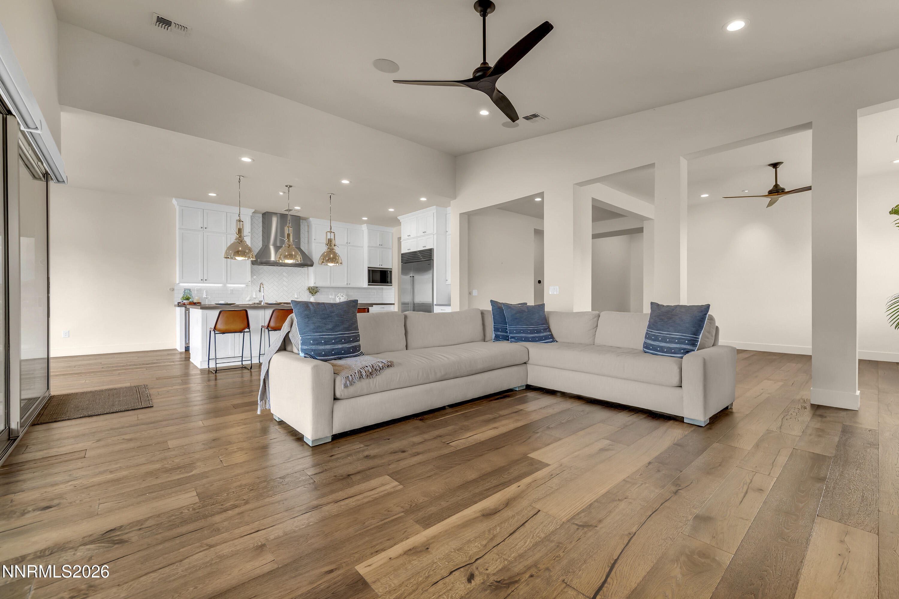 9219 Wild Skies Court Reno, NV 89523 - Photo 8 of 38 a living room with furniture and a wooden floor