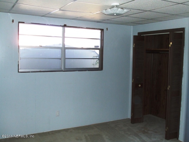 2323 Chaffee Road South Jacksonville, FL 32221 - Photo 8 of 14 an empty room with a window