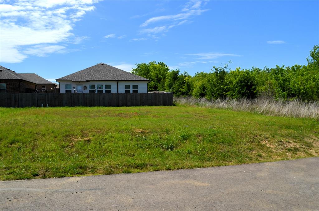 311 Rike Road Mabank, TX 75147 - Photo 4 of 6 a front view of a house with a yard and lake view