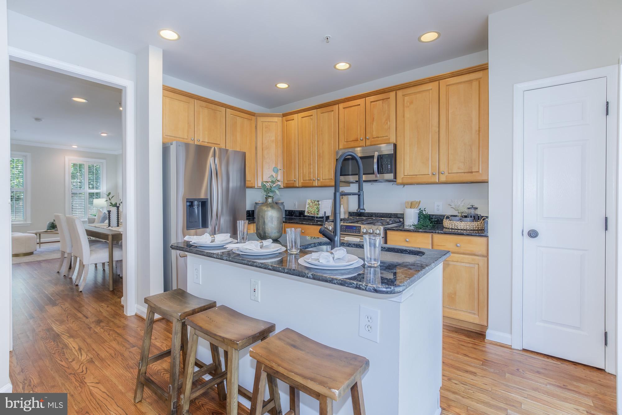 815 G Street Southwest Washington, DC 20024 - Photo 12 of 32 Modern kitchen with warm wood accents.