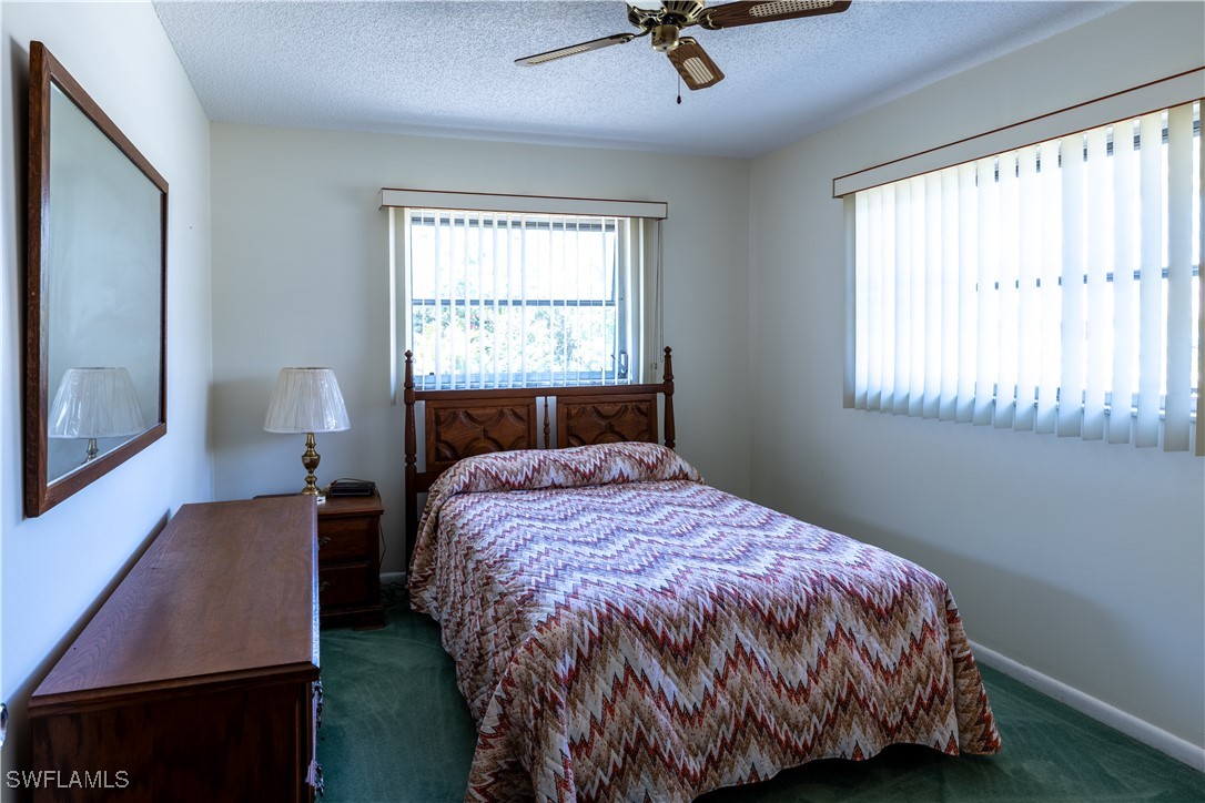 4646 Palm Tree Boulevard Cape Coral, FL 33904 - Photo 14 of 36 a bedroom with a bed and window