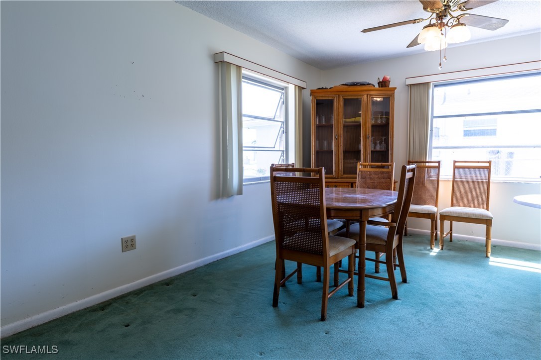 4646 Palm Tree Boulevard Cape Coral, FL 33904 - Photo 20 of 36 a view of a dining room with furniture window and outside view