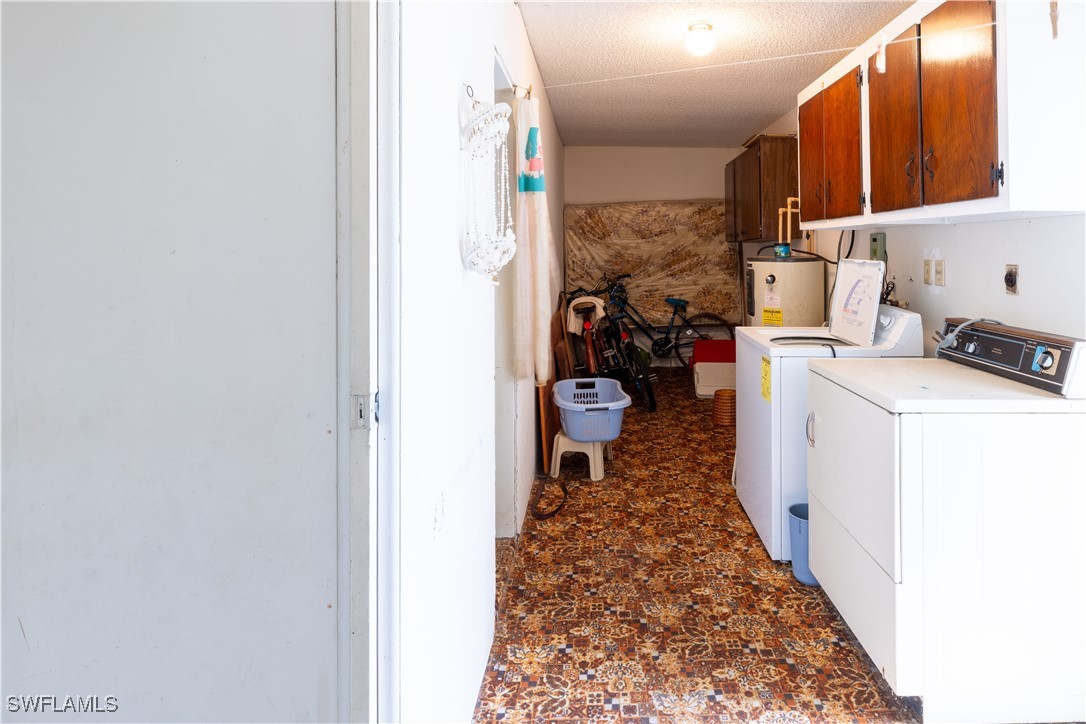 4646 Palm Tree Boulevard Cape Coral, FL 33904 - Photo 22 of 36 a storage room with washer and dryer