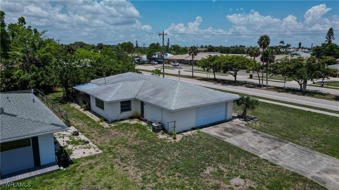 4646 Palm Tree Boulevard Cape Coral, FL 33904 - Photo 26 of 36 an aerial view of a house with swimming pool garden and patio