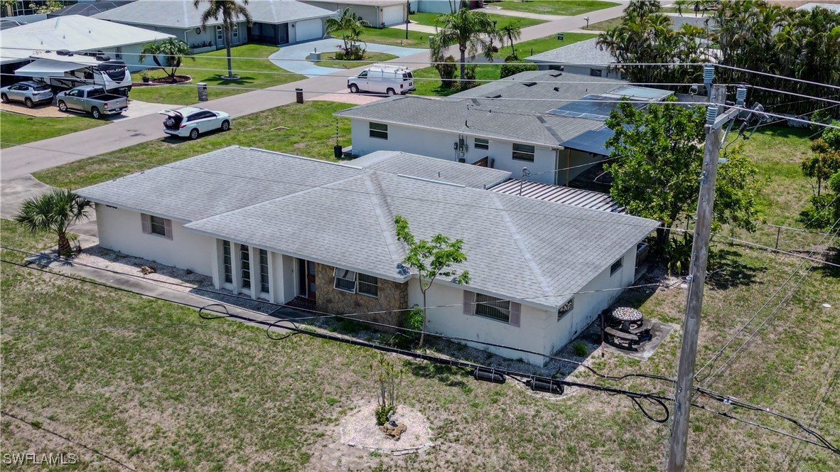 4646 Palm Tree Boulevard Cape Coral, FL 33904 - Photo 30 of 36 an aerial view of a house with a yard and large trees