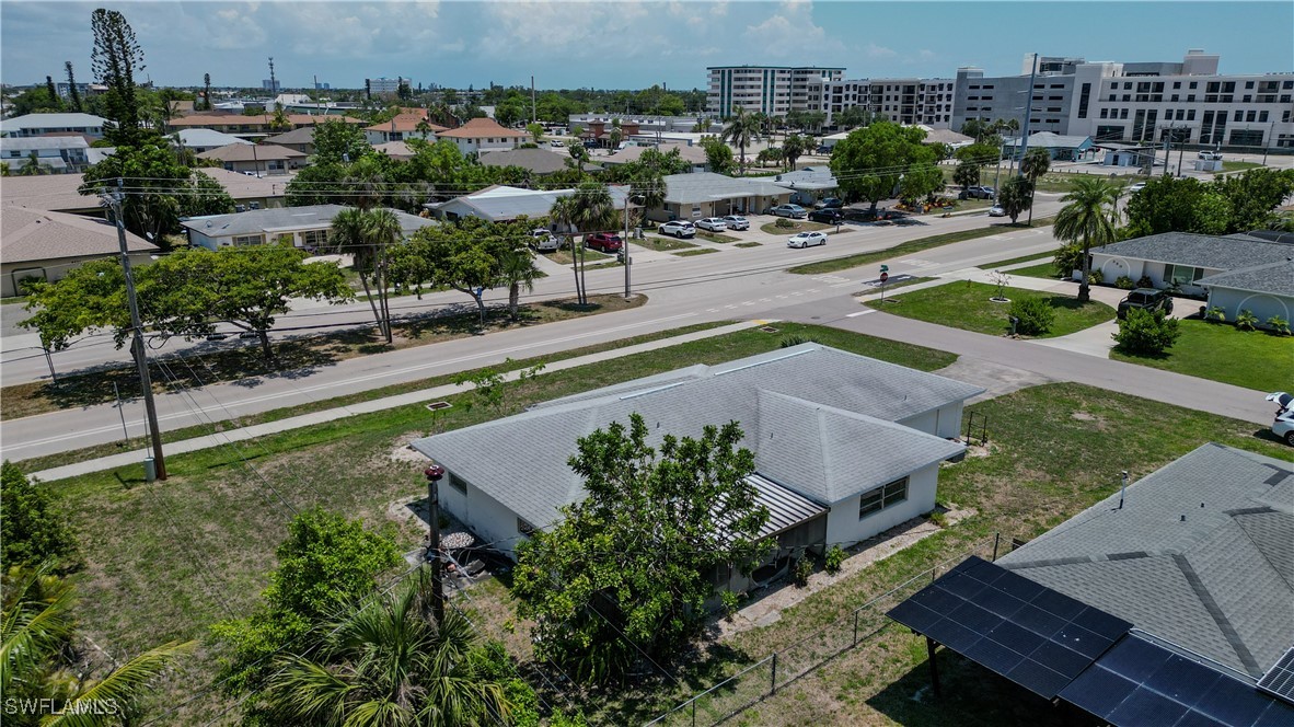 4646 Palm Tree Boulevard Cape Coral, FL 33904 - Photo 32 of 36 an aerial view of a house with a yard and lake view
