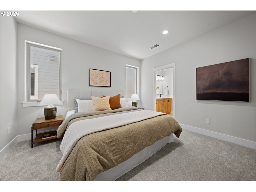 2469 North Villa Road Newberg, OR 97132 - Photo 5 of 7 a bedroom with a bed and a flat screen tv