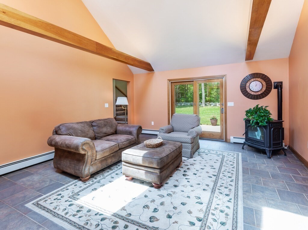 28 Cottage Road Dudley, MA 01571 - Photo 11 of 39 a living room with furniture and a rug