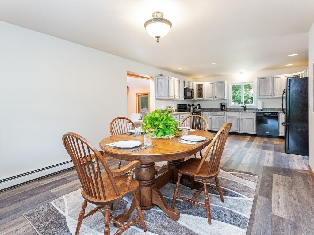 28 Cottage Road Dudley, MA 01571 - Photo 15 of 39 a view of a dining room with furniture and wooden floor