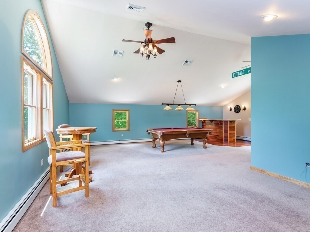 28 Cottage Road Dudley, MA 01571 - Photo 23 of 39 a view of game room with windows and wooden table