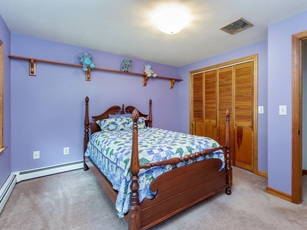 28 Cottage Road Dudley, MA 01571 - Photo 30 of 39 a bedroom with a bed and a table