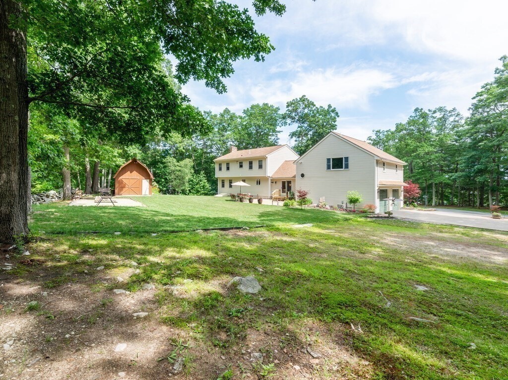 28 Cottage Road Dudley, MA 01571 - Photo 6 of 39 a front view of a house with garden