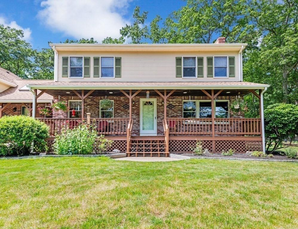 28 Cottage Road Dudley, MA 01571 - Photo 7 of 39 front view of a house with a garden