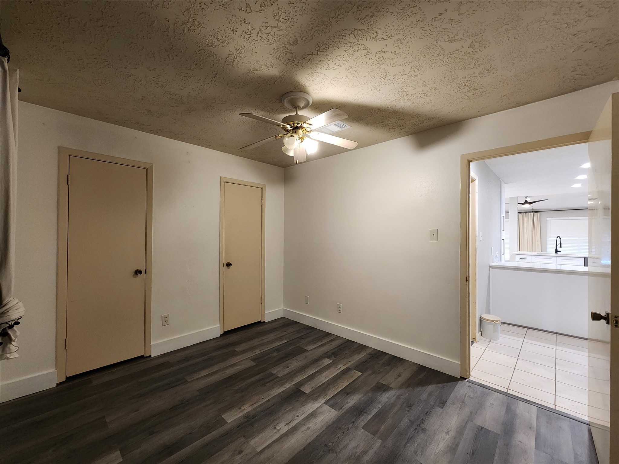 8327 Bird Run Drive Houston, TX 77489 - Photo 12 of 18 a view of an empty room with window and wooden floor