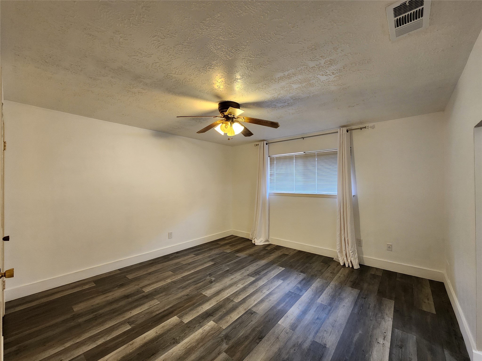 8327 Bird Run Drive Houston, TX 77489 - Photo 13 of 18 wooden floor in an empty room