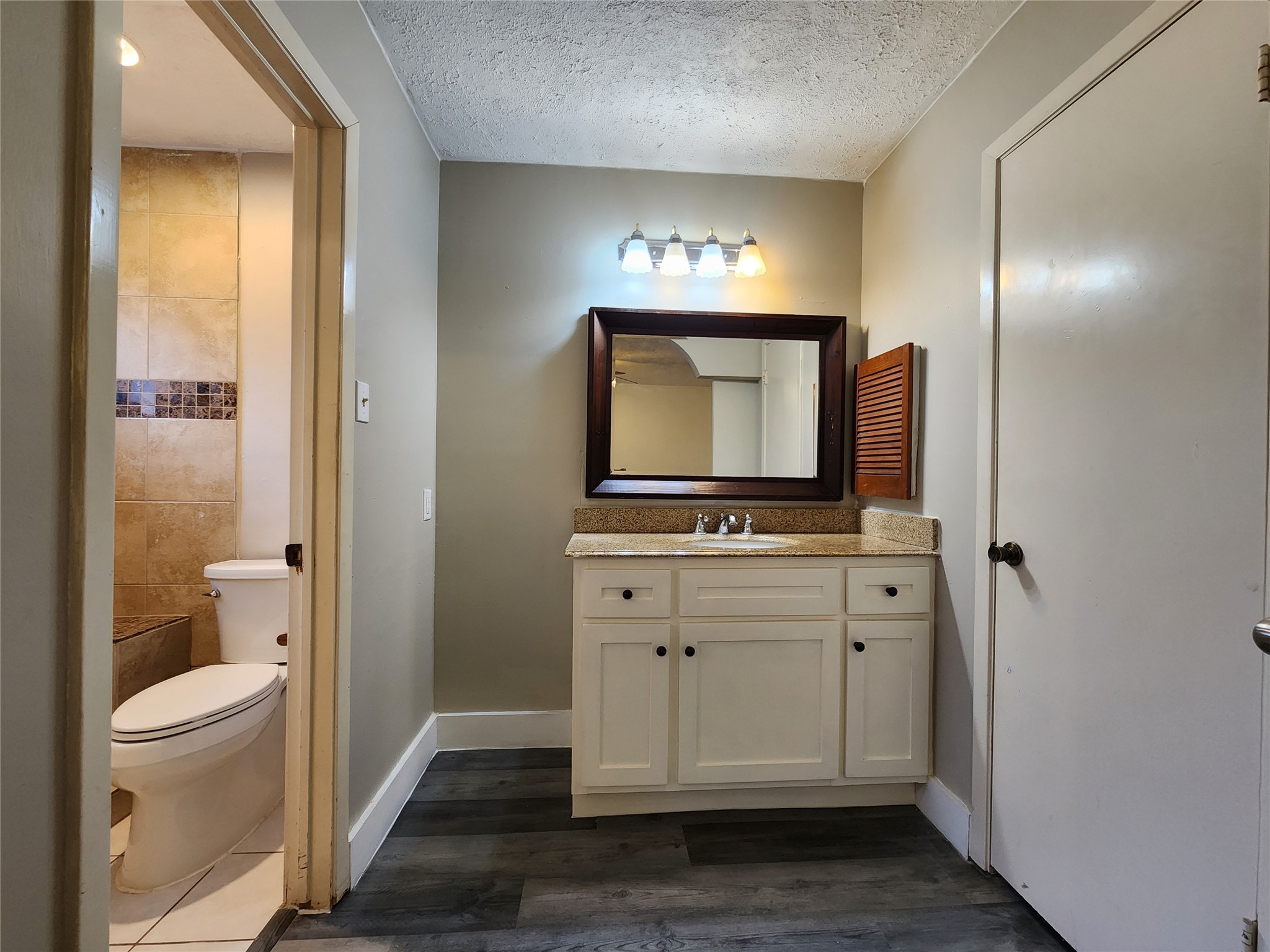 8327 Bird Run Drive Houston, TX 77489 - Photo 15 of 18 a bathroom with a toilet sink and mirror