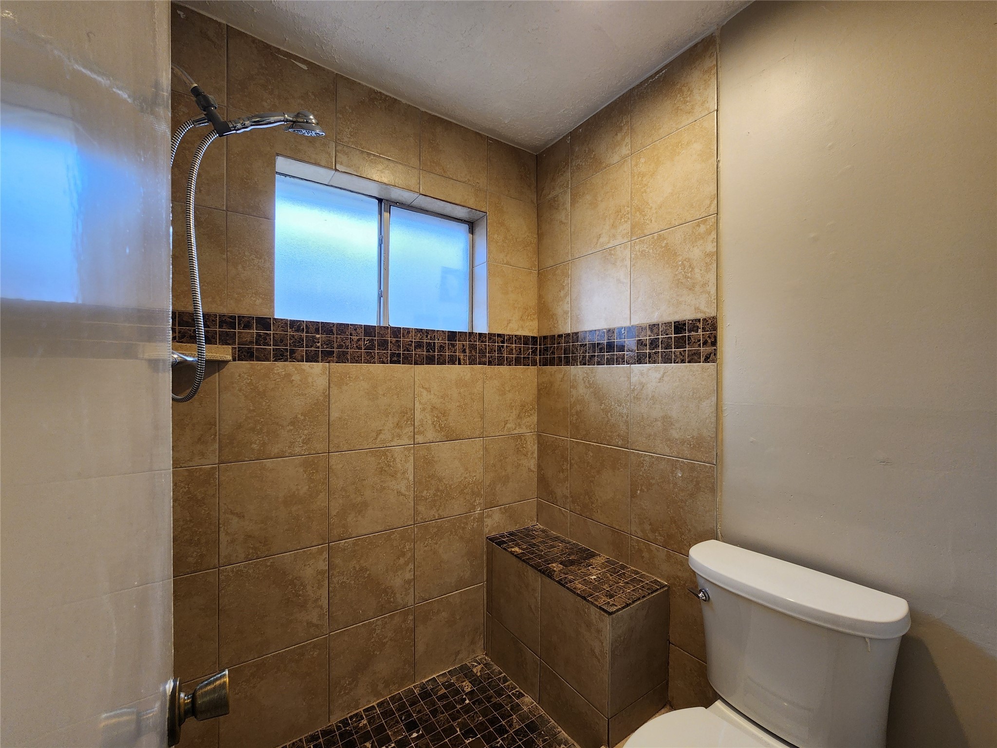 8327 Bird Run Drive Houston, TX 77489 - Photo 16 of 18 a bathroom with a toilet and a shower