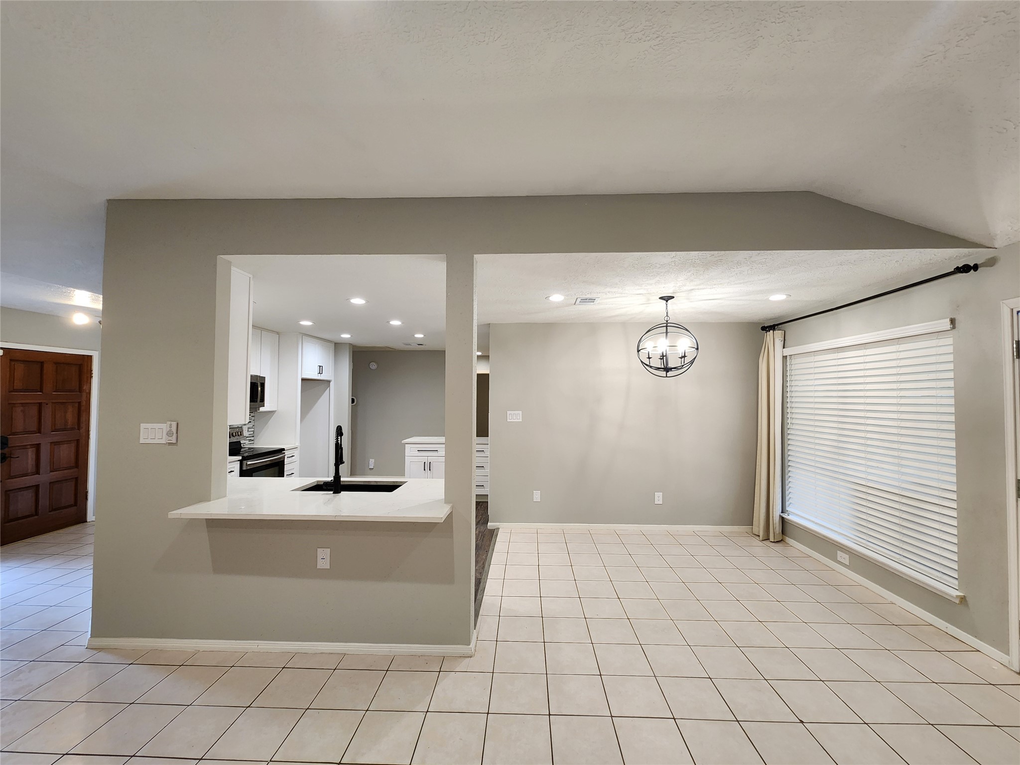 8327 Bird Run Drive Houston, TX 77489 - Photo 5 of 18 a view of a living room and kitchen with a sink