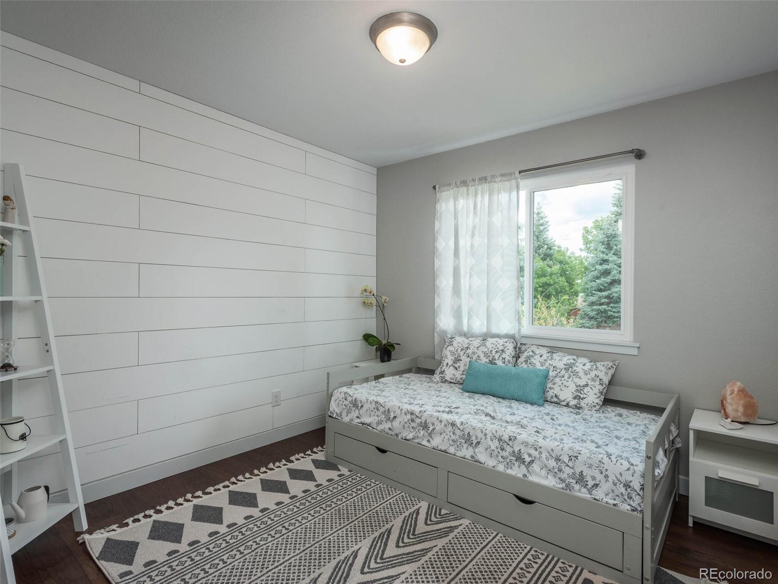 1005 Northridge Road Highlands Ranch, CO 80126 - Photo 11 of 28 a bedroom with a bed and a window