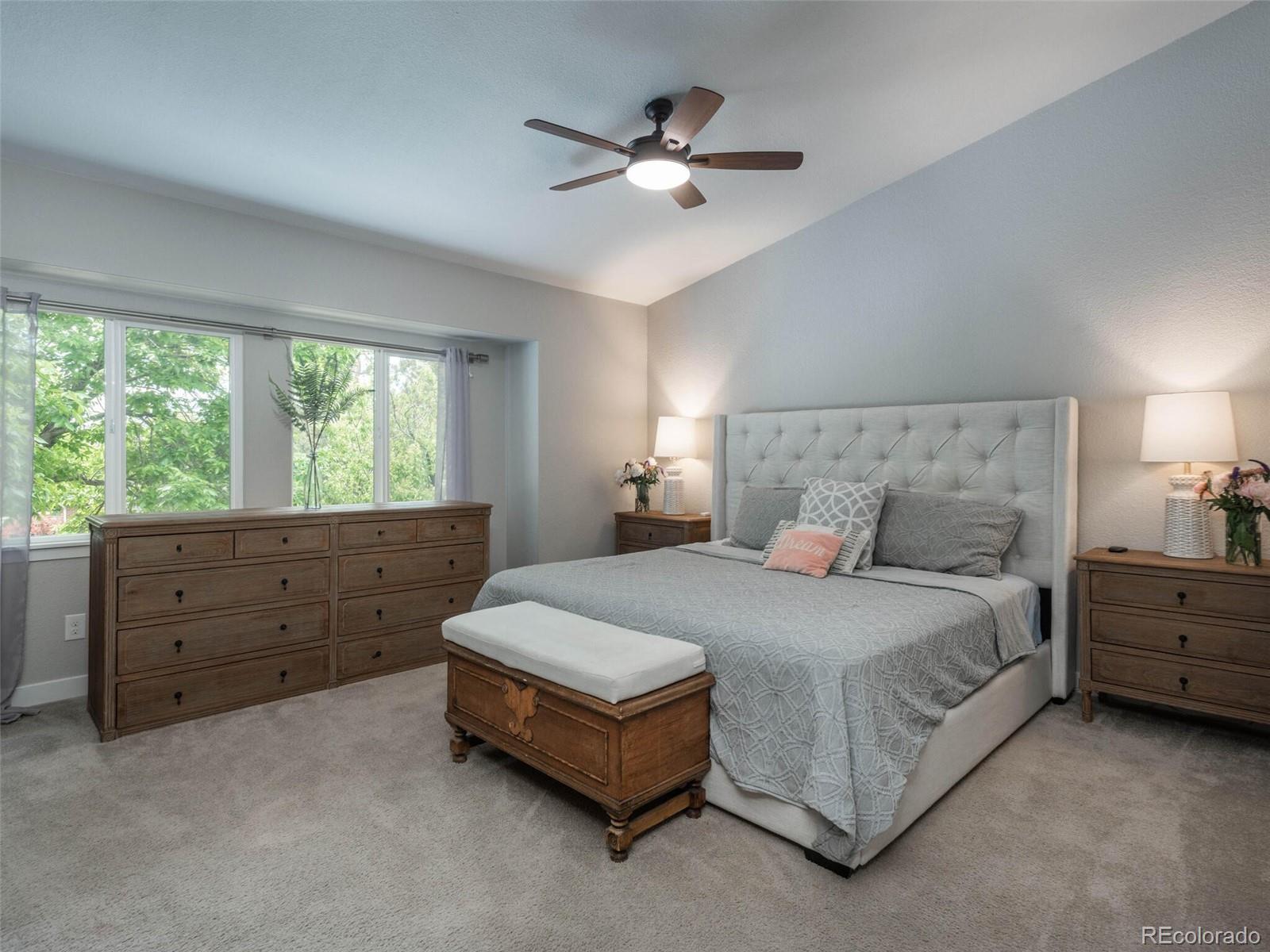 1005 Northridge Road Highlands Ranch, CO 80126 - Photo 13 of 28 a bed room with a bed and a dresser