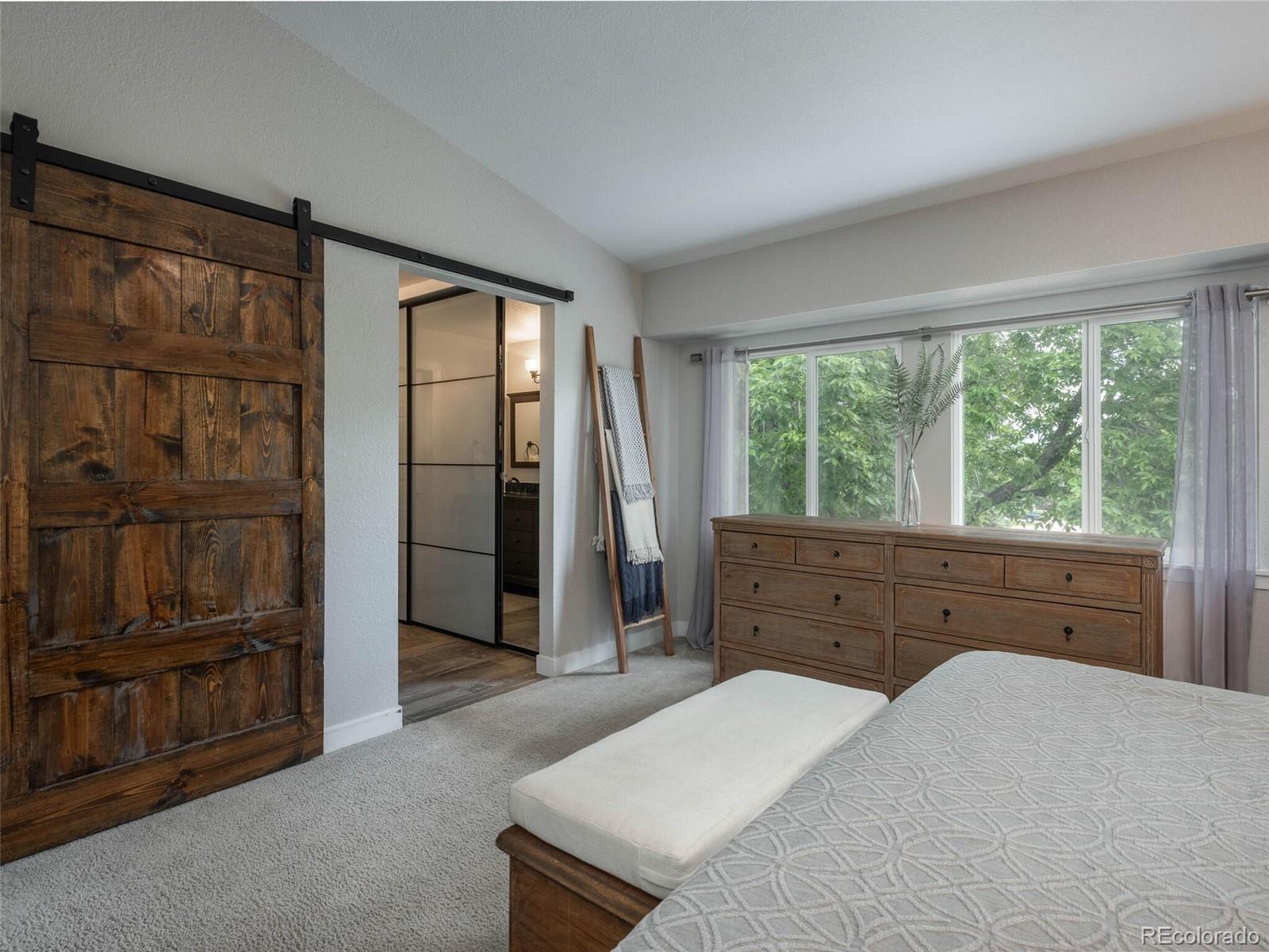 1005 Northridge Road Highlands Ranch, CO 80126 - Photo 14 of 28 a bed room with a bed and a window