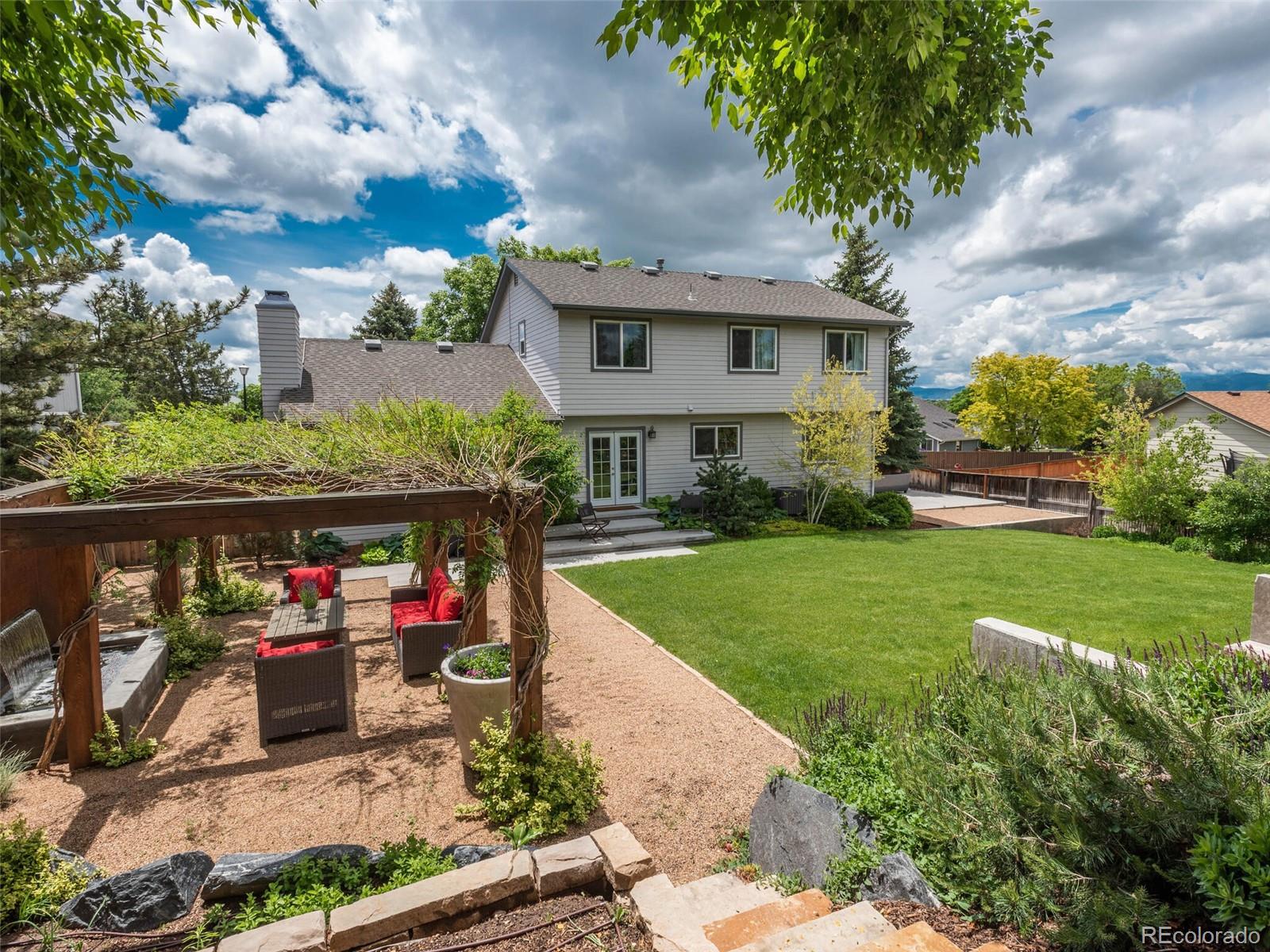 1005 Northridge Road Highlands Ranch, CO 80126 - Photo 23 of 28 a front view of house with yard