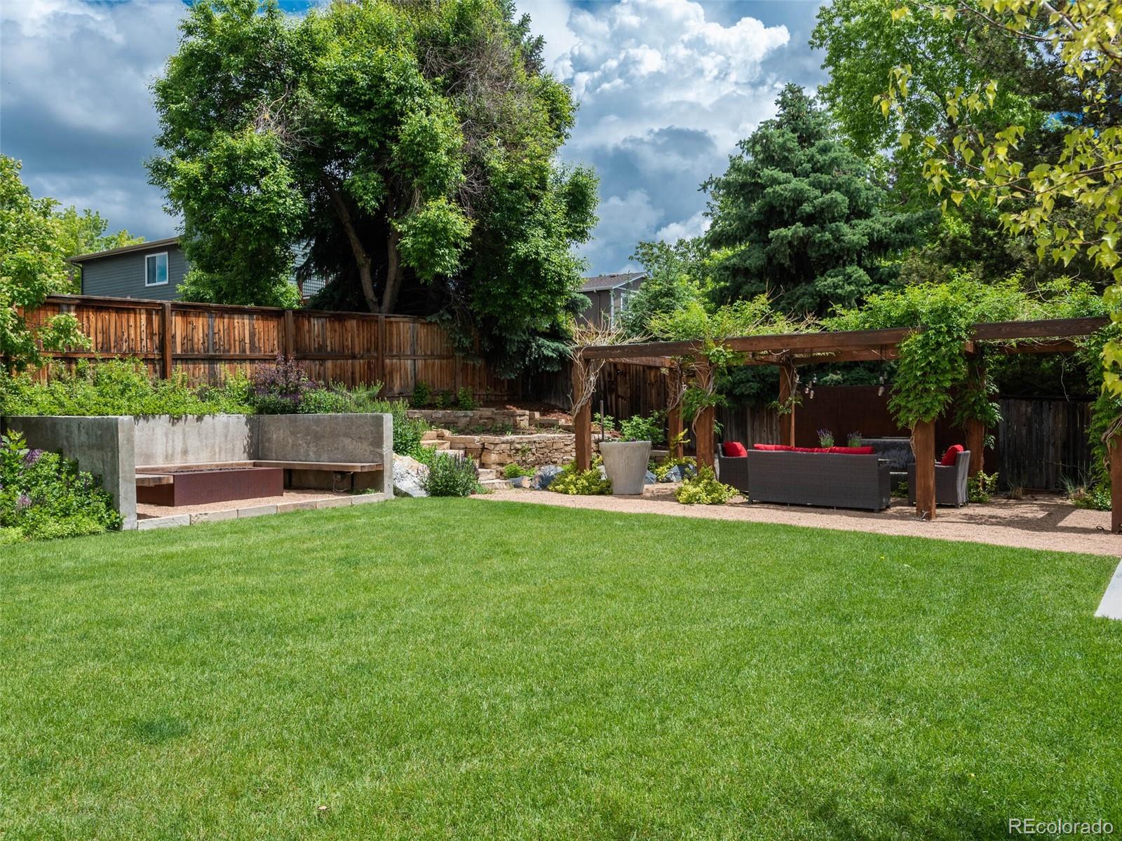 1005 Northridge Road Highlands Ranch, CO 80126 - Photo 28 of 28 a view of back yard of the house with a patio