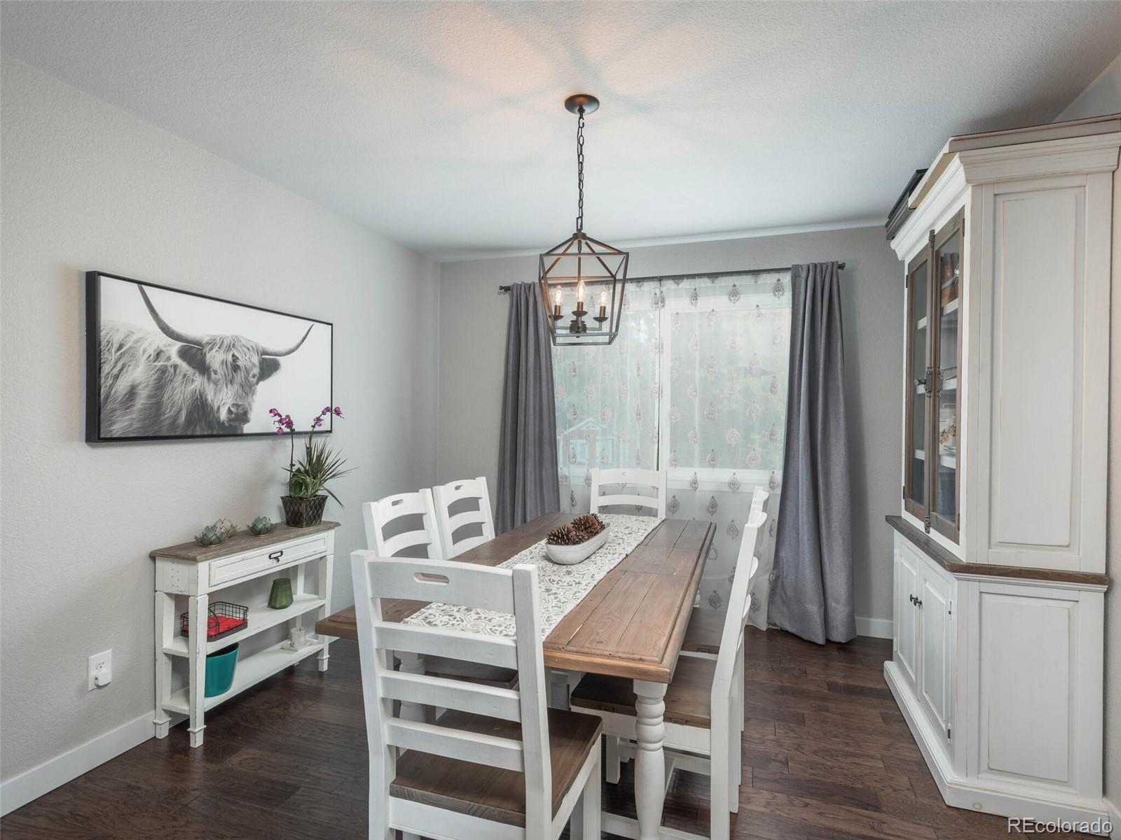 1005 Northridge Road Highlands Ranch, CO 80126 - Photo 4 of 28 a dining room with furniture and window
