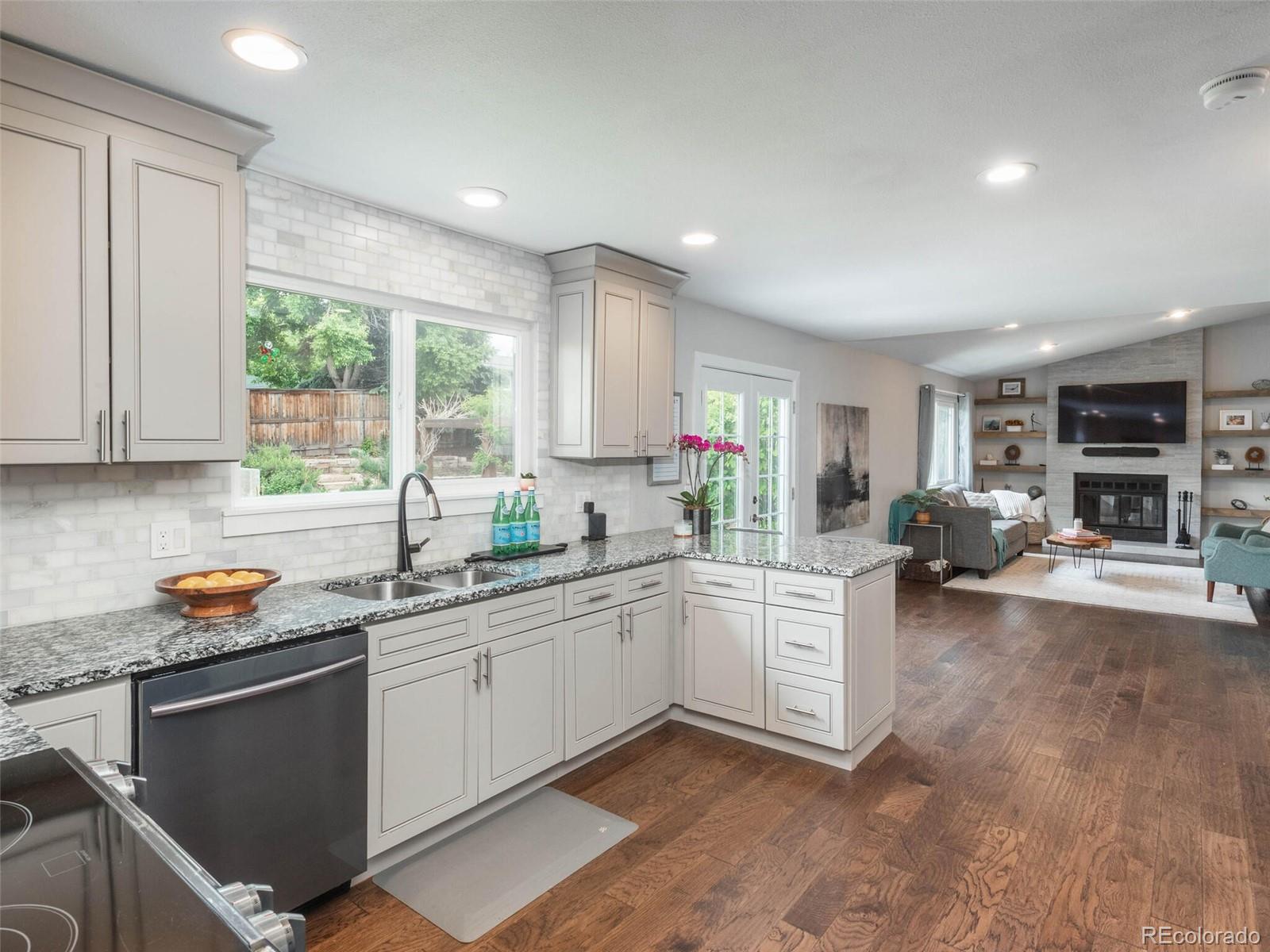 1005 Northridge Road Highlands Ranch, CO 80126 - Photo 5 of 28 a kitchen with sink cabinets and window