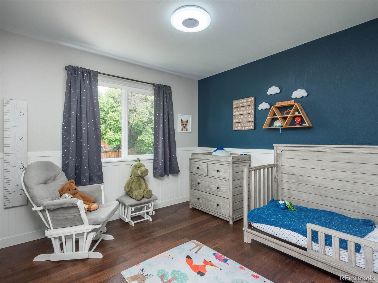 1005 Northridge Road Highlands Ranch, CO 80126 - Photo 10 of 28 a bedroom with furniture and a window