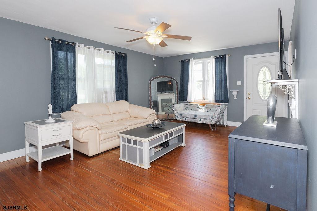 19 South 1st Road Hammonton, NJ 08037 - Photo 6 of 36 a bedroom with a bed chandelier and a window